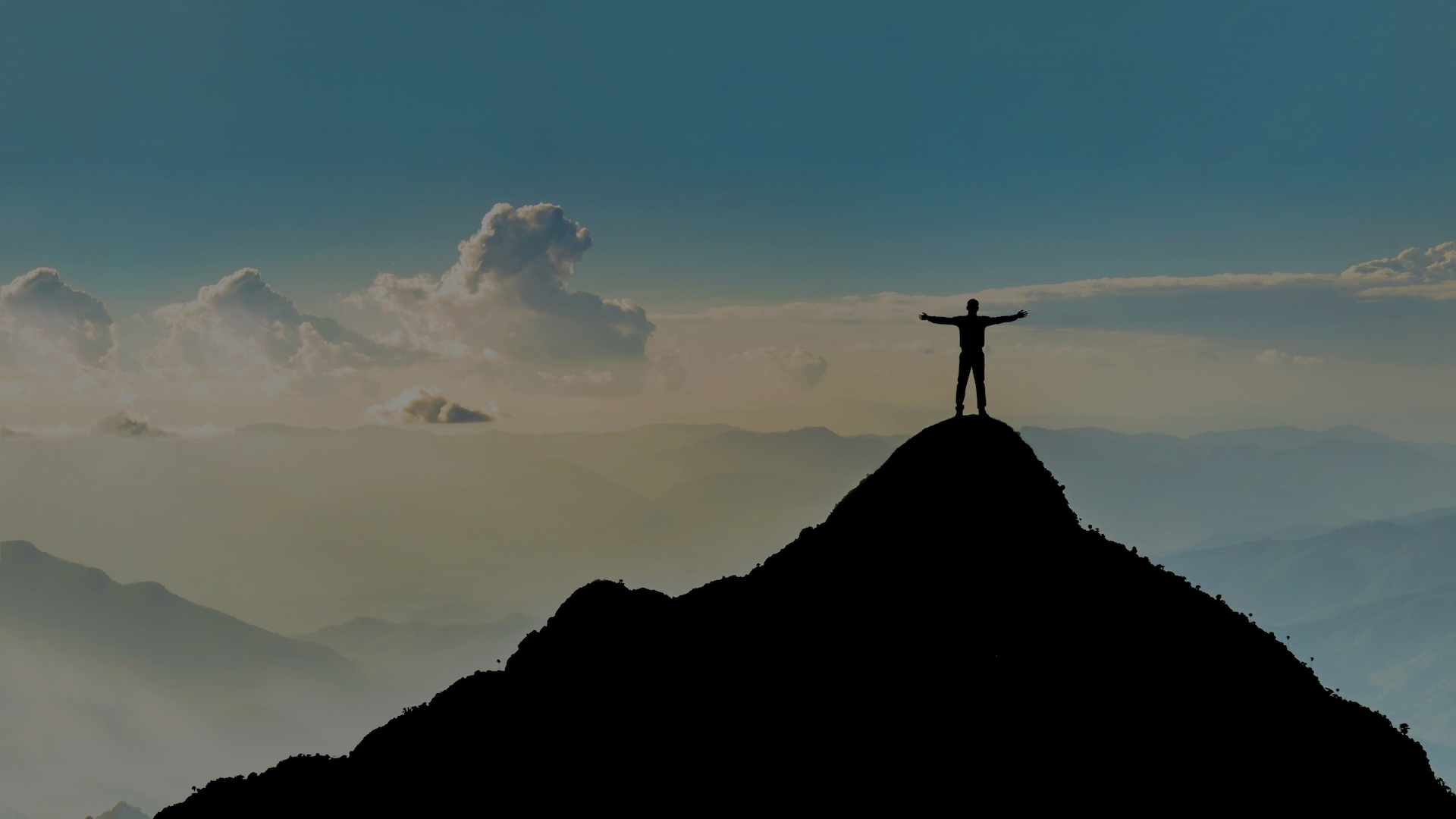 Businessman success raising arms stand on top of hill